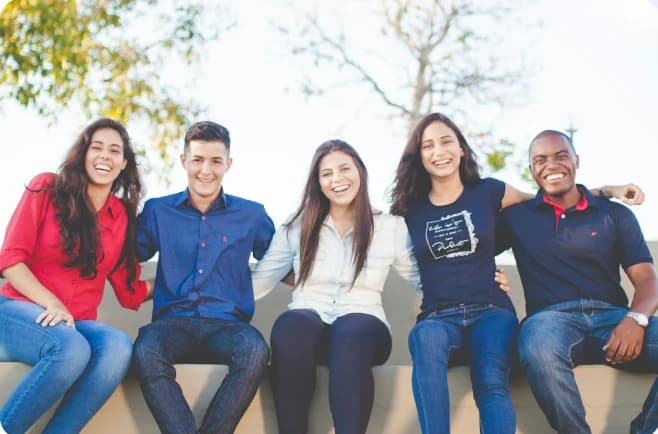 Group of students smiling outdoors